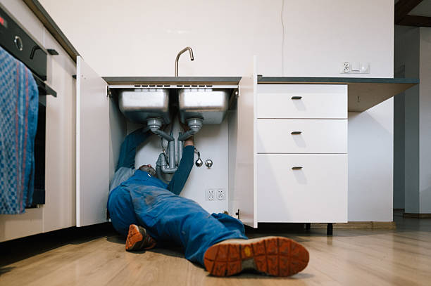 Professional Emergency Plumber technician working in Malta, IL